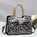 Chic leopard print patent leather handbag with rhinestone bow and gold metal handles - L29 W12 H21 / Black