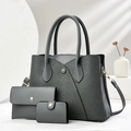 Close-up of grey textured handbag 3-piece set with woven patterns and gold hardware - Tote Bag, Purse And Card Holder / Gray