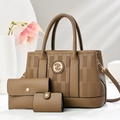 Detailed view of brown litchi pattern leather bag set with gold G logo and 3D textures - Brown