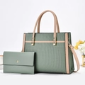 Detail of green striped tote bag with matching wallet and embossed geometric patterns - Tote Bag And Wallet Combination / Green