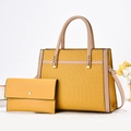 Detail of yellow striped tote bag with matching envelope wallet and textured G-patterning - Tote Bag And Wallet Combination / Yellow