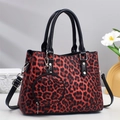 Red leopard print tote bag with double handles and a matching round coin purse charm - Red