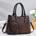 Detailed view of leopard print tote bag with round coin purse and black leather handle - Coffee
