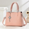 Minimalist light pink lychee pattern shoulder bag with a pearl charm and silver strap - Pink