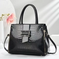 Chic black faux crocodile skin handbag with glossy finish and detachable shoulder strap - Black
