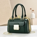 Detail of dark green leather handbag featuring golden metal buckle and pearl clasp top - 23*14*17CM / Dark Green