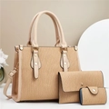 Close-up of khaki tote set with vertical wave embossed faux leather and gold hardware - Khaki