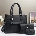 Detailed view of black 3-in-1 pebble grain bag set with gold rivets and hardware - Black
