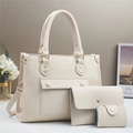 Three-piece set of cream white pebbled leather tote, envelope pouch, and card holder - Off-white