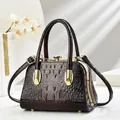 Brown crocodile textured handbag with crystal clasp and gold hardware for evening gala - Coffee