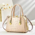 Elegant crocodile-patterned evening bag in beige with rhinestone clasp and gold hardware - Khaki