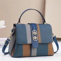 Detail of blue striped woven texture and gold ring buckle on women's crossbody bag - Blue