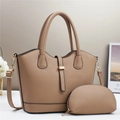 Close-up of litchi grain leather tote and small pouch set with gold hardware in beige - Khaki