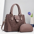 Detail of brown geometric quilted tote bag set with golden hardware and purple tulips - Coffee