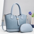 Detail of light blue pleated tote with gold hardware and small matching zip pouch - Blue