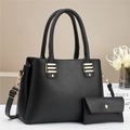 Close-up of black lychee texture leather tote bag set with golden metal hardware detail - 2-Piece Set / Black