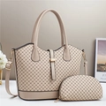 Detail of beige tote set showing geometric printed texture and gold metal hardware - Khaki
