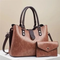 Detail of vintage brown leather tote bag set with matching envelope pouch and hardware - Pink