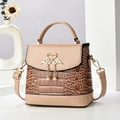Chic brown crocodile pattern handbag with swan buckle and apricot patent leather accents - Khaki
