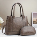 Brown tote bag and matching coin purse with adjustable strap on a minimalist background - Coffee