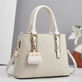 Detail of cream striped fabric handbag featuring gold hardware and mini charm accessory - Off-white