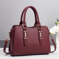 Minimalist wine red pebbled leather tote bag with gold metal accents and shoulder strap - Red