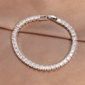 Silver finish tennis bracelet with square-cut zircons on brown silk background - Silver Square Cut Style (BP2211A)