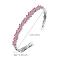 Detailed macro view of adjustable silver bracelet with wavy pink zircon inlay - Rose Red