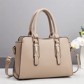 Elegant beige lychee grain tote bag with gold hardware and adjustable strap on minimal background - Khaki