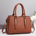 Close-up of brown litchi pattern leather tote bag with gold metal hardware and handles - Khaki/Earth Yellow