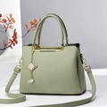 Elegant light green lychee pattern tote bag with gold metal frame and pearl charm detail - Green