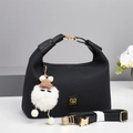 Black textured shoulder bag with gold floral logo, plush pendant and orchid decor - Black