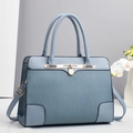 Light blue pleated tote bag with golden hardware and round metal pendant detail - Sky Blue