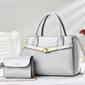 Detail of grey crocodile embossed tote bag and matching mini chain bag with gold hardware - Pure White
