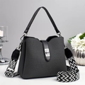 Textured grey bucket bag with a patterned wide shoulder strap and silver clasp - Green