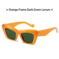 Vintage cat-eye sunglasses with orange frames and dark green lenses in a 45-degree view - C3 Orange Frame Green Lens