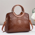 Detail of soft brown faux crocodile skin texture and gold rivets on oversized tote bag - Khaki/Earth Yellow
