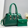 Close-up of green crocodile embossed patent leather tote bag with matching coin purse - Green