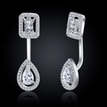 Macro view of silver teardrop and emerald-cut cubic zirconia earrings with pavé halo - Earrings / Silver