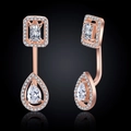 Detail of rose gold drop earrings featuring sparkling square and waterdrop zircon stones - Earrings / Rose Gold