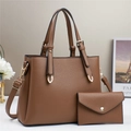 Detailed close-up of brown litchi pattern leather tote bag with matching envelope pouch - Khaki