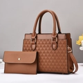 Brown leather two-piece bag set with geometric embossing and gold hardware on white table - Earthy Yellow