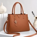 Deep brown lychee pattern leather tote bag with gold V hardware on white stand - Khaki/Earth Yellow