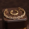 Set lussuoso di bracciale e anello geometrico in oro con zirconi scintillanti - Set Bracciale e Anello Oro