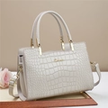 Detail of cream tote bag featuring crocodile embossed texture and golden metal hardware - Off White