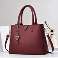 Women's burgundy faux leather handbag featuring a gold V-motif and pebble texture - Wine Red