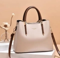 Minimalist cream shoulder bag with brown leather straps and gold metal hardware accents - Khaki