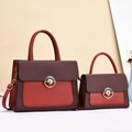 Elegante borsa a mano bordeaux con patta intrecciata e chiusura in metallo dorato - Rosso Vino