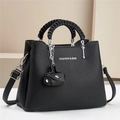 Chic black litchi pattern crossbody bag with braided handles and silver hardware - Black