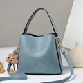 Chic light blue faux leather bucket bag with cute cloud charm and gold hardware detail - Blue